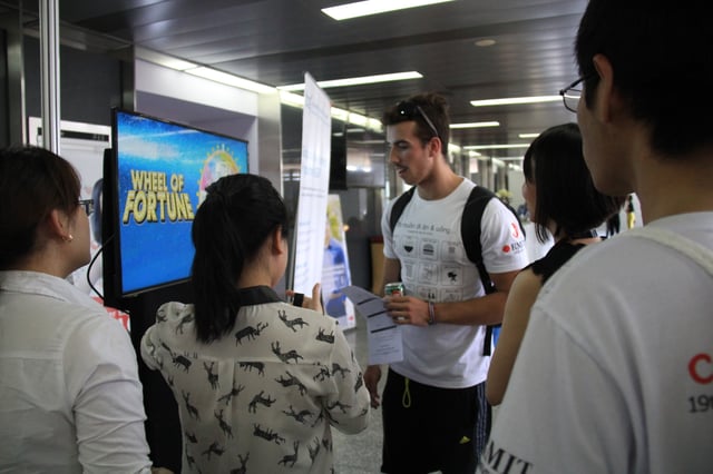 RMIT-student-played-game-at-TRG-information-booth.jpg